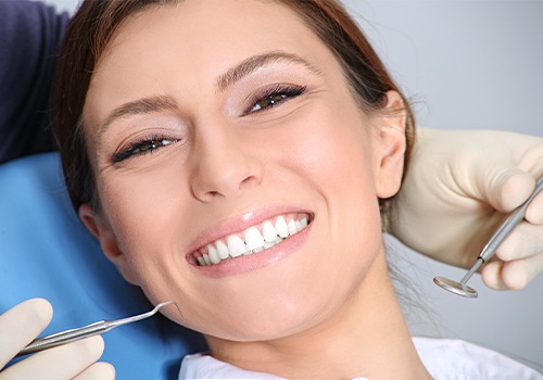 Woman receiving emergency dentistry treatment