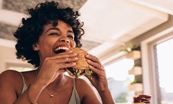 Woman enjoying meal at restaurant