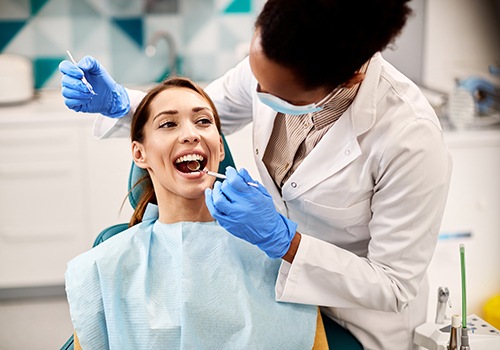A young woman about to get a dental checkup and cleaning