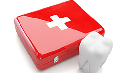 Tooth next to a dental emergency kit