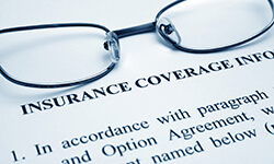 Insurance coverage information form with glasses