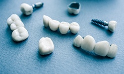 types of dental implants in San Antonio on blue background