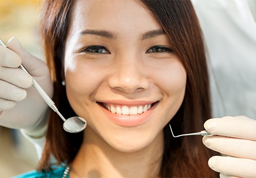 Woman receiving dental checkup