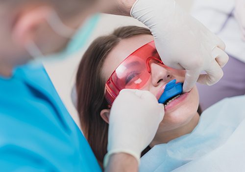 Woman receiving fluoride treatment