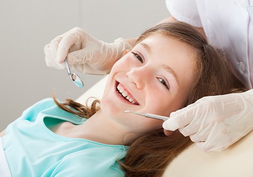 Teen girl receiving children's dentistry