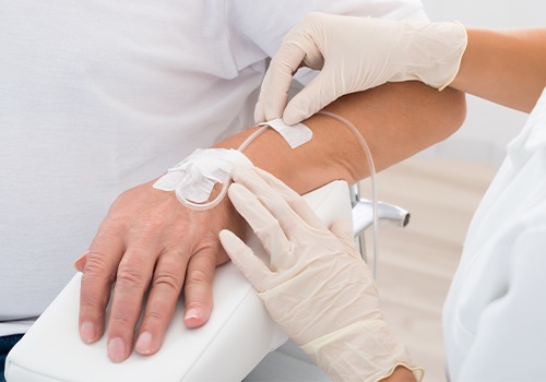 Man receiving IV sedation dentistry