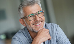 Closeup of man with glasses smiling