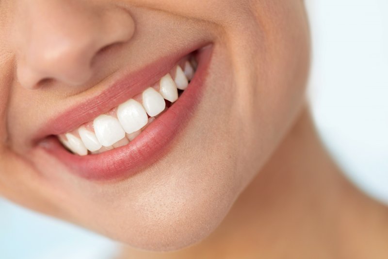 Closeup of woman with white teeth and balanced smile