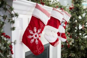 a fireplace mantle with stockings arranged on it